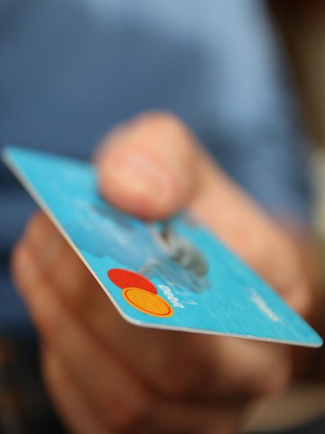 hand offering a card
